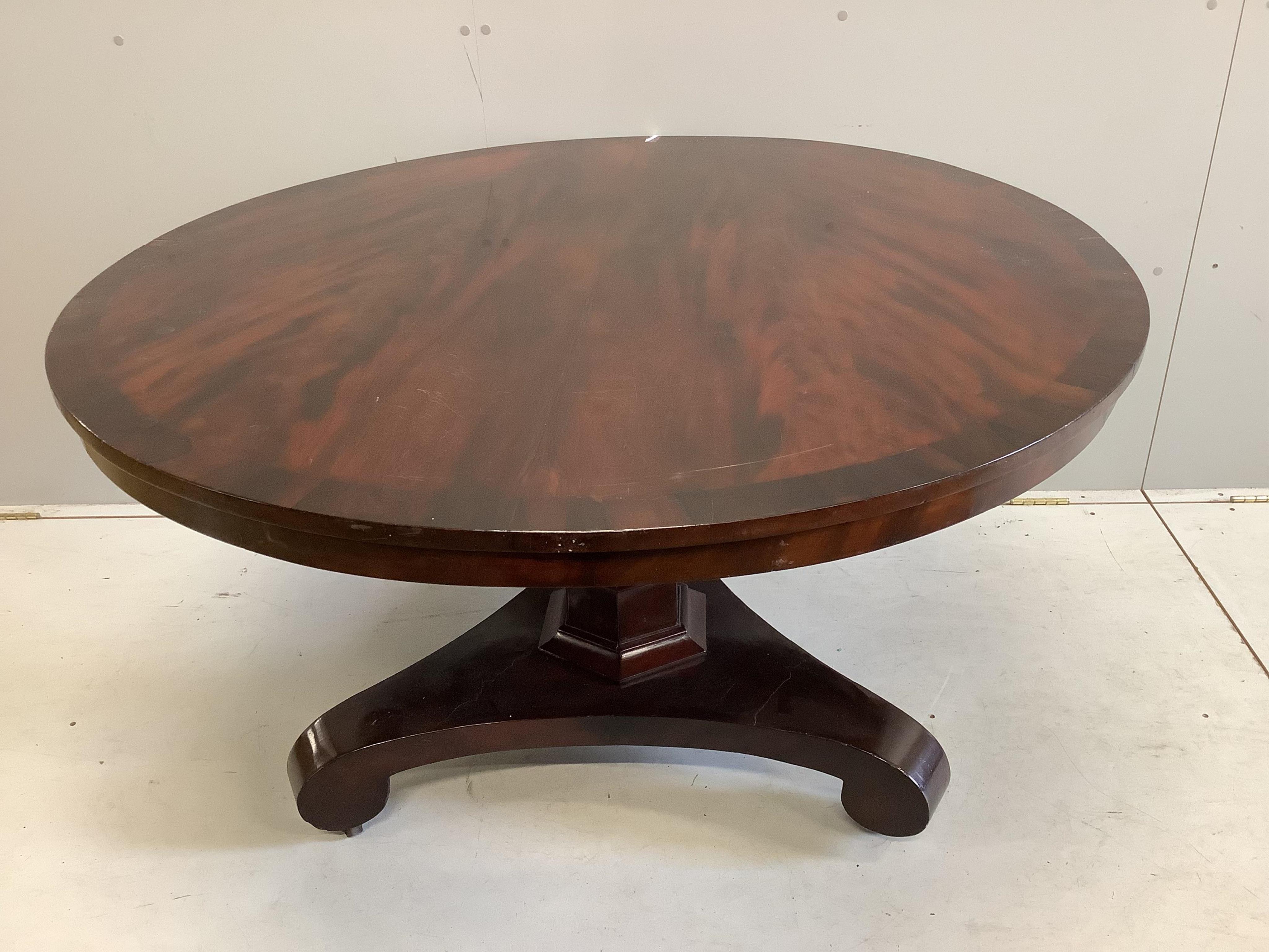 An early Victorian mahogany tilt top breakfast table, diameter 124cm, height 72cm. Condition poor to fair.